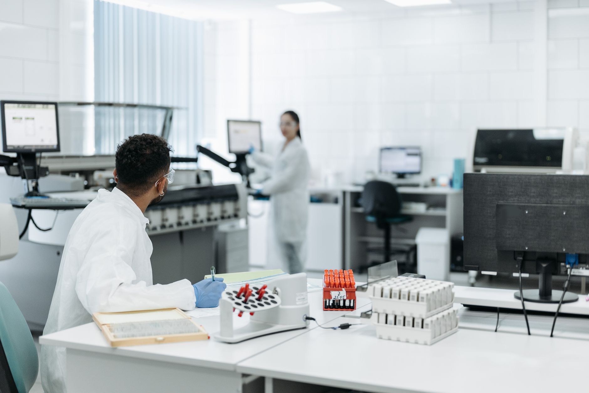 Laboratory technicians preparing samples for transport