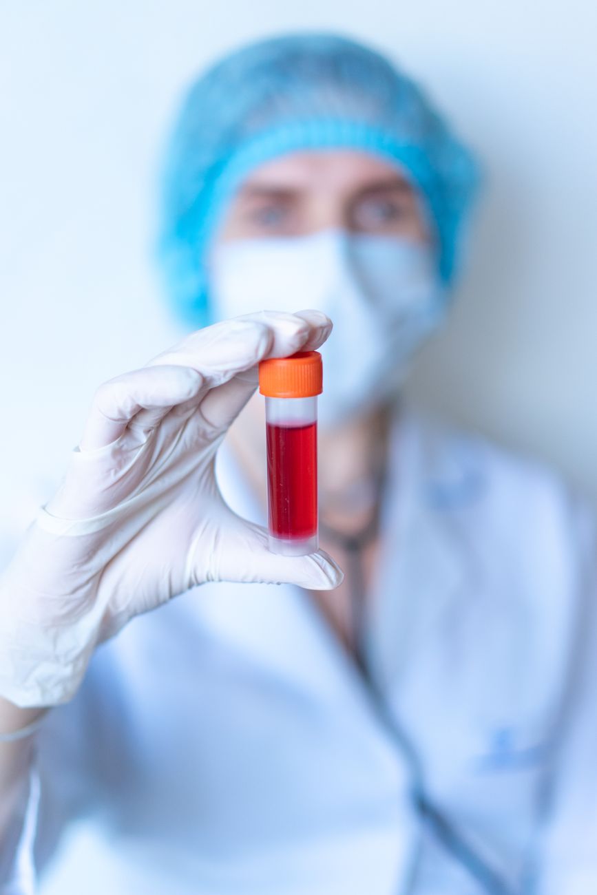 Doctor inspecting a medical vial